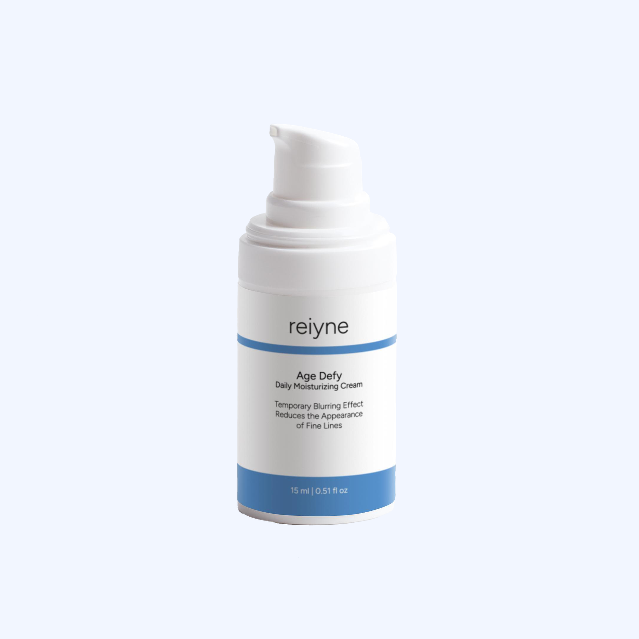 Reiyne Age Defy Daily Moisturizer in a white airless pump bottle with blu and white label on a grey background