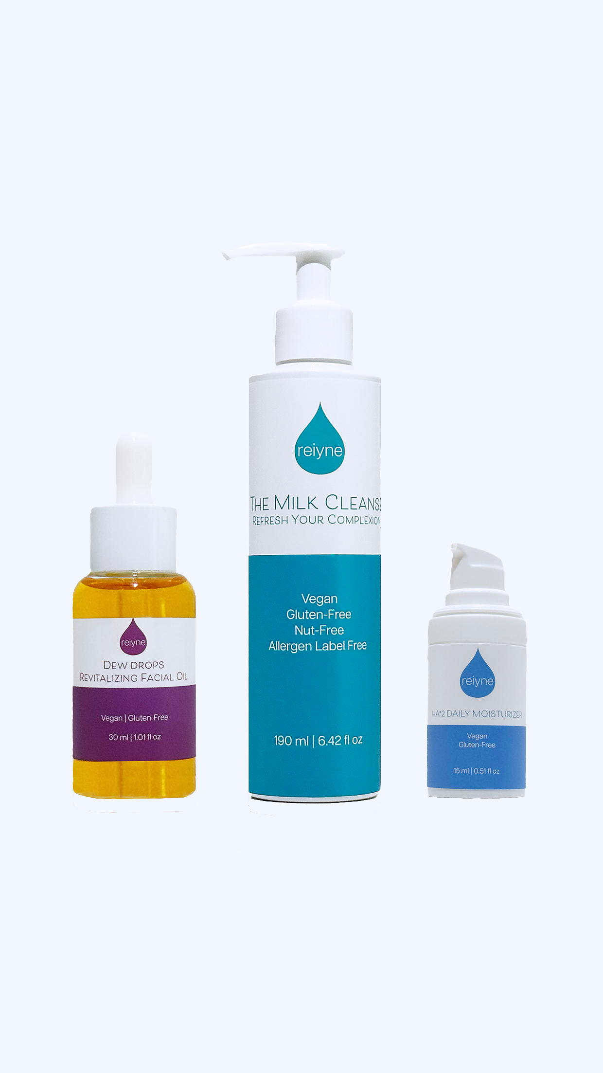 Reiyne Dew Drop Glow Set front purple and green box with The Milk Cleanse, HA*2 Daily Moisturizer and Dew Drops