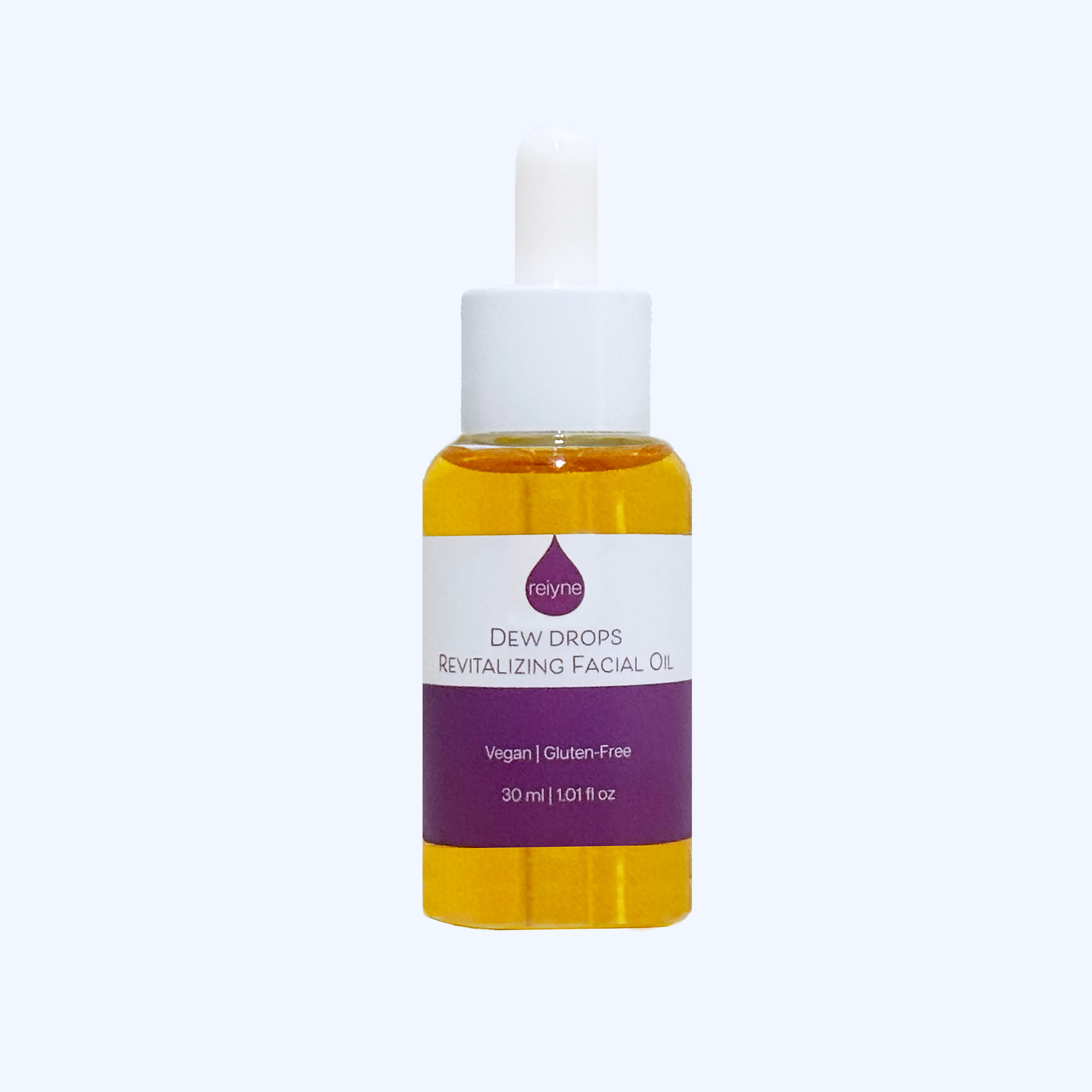 Reiyne Dew Drops Revitalizing Facial Oil in a clear bottle with White Dropper and a purple and white label
