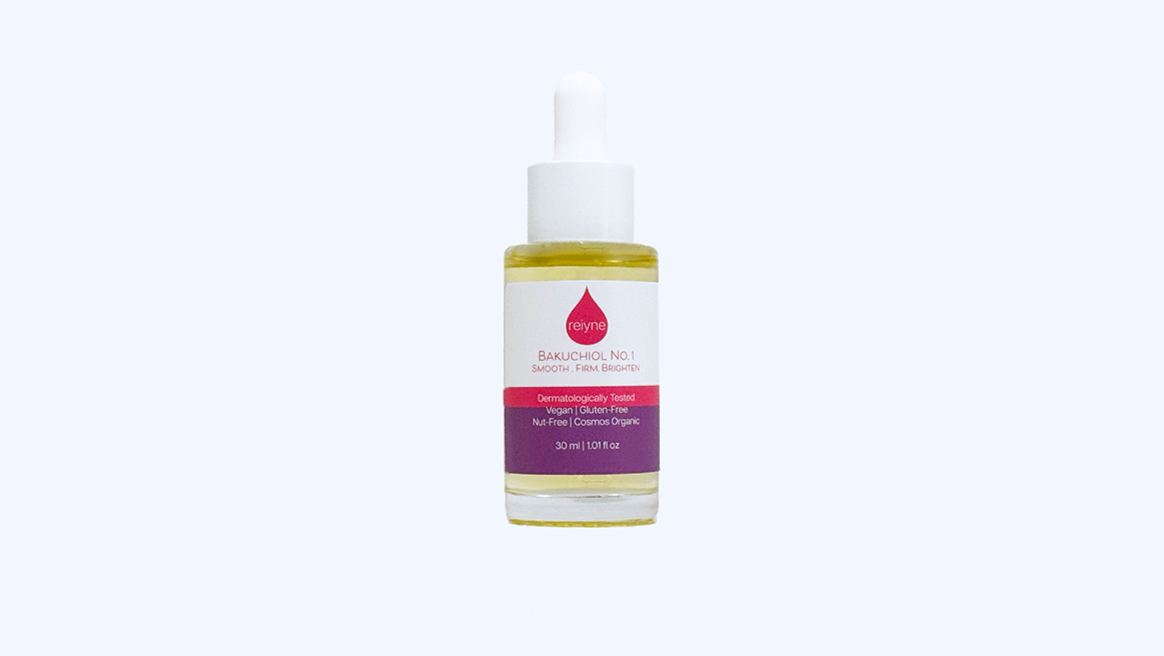 Reiyne Bakuchiol No. 1 in a clear bottle with a white dropper and a purple pink and white label