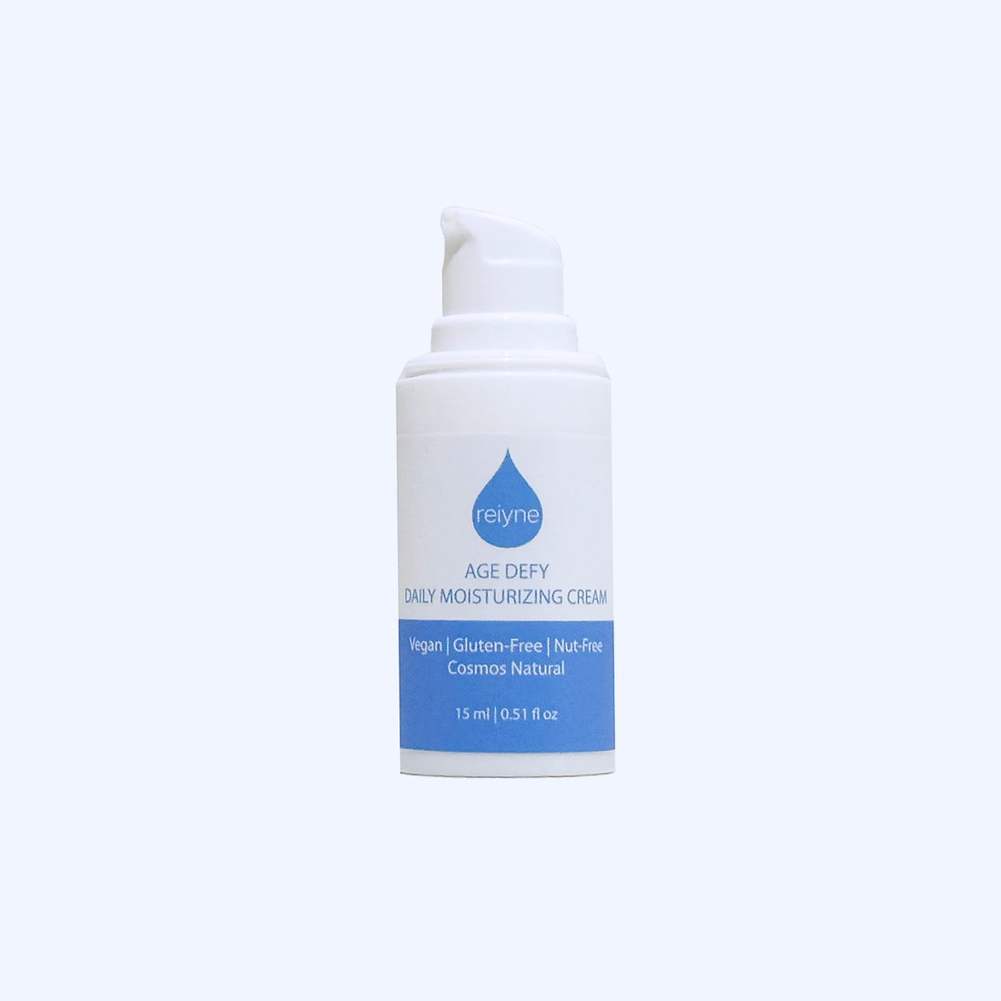 Reiyne Age Defy Daily Moisturizer in a white airless pump bottle with blu and white label on a grey background