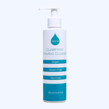 Reiyne Clarifying Foaming Cleanser in a white pump bottle with blue and white label