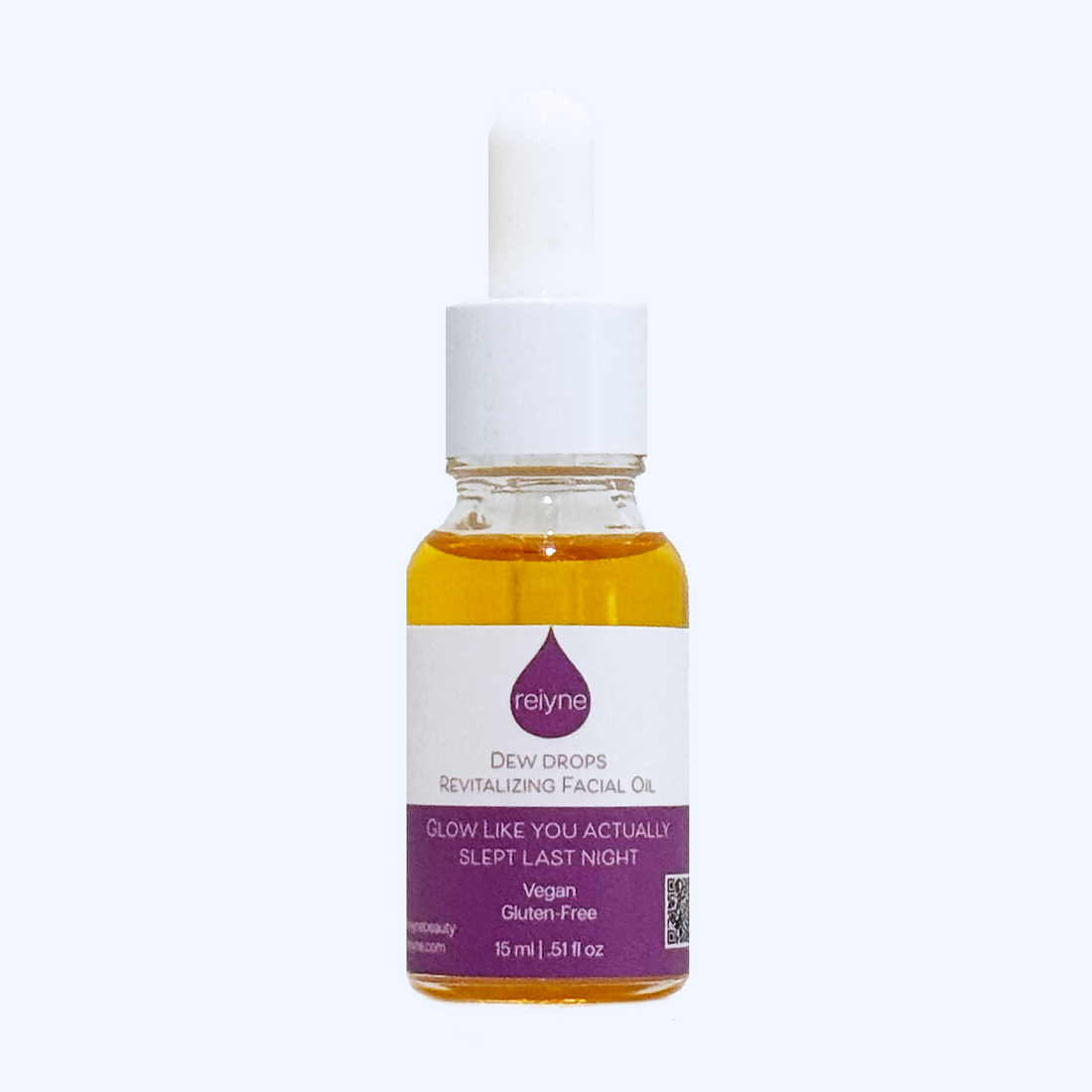  Reiyne Dew Drops Revitalizing Facial Oil in a clear bottle with White Dropper and a purple and white label