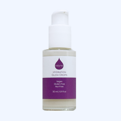 Reiyne Hydration Glow Drops in clear bottle with white airless pump and purple and white label and box