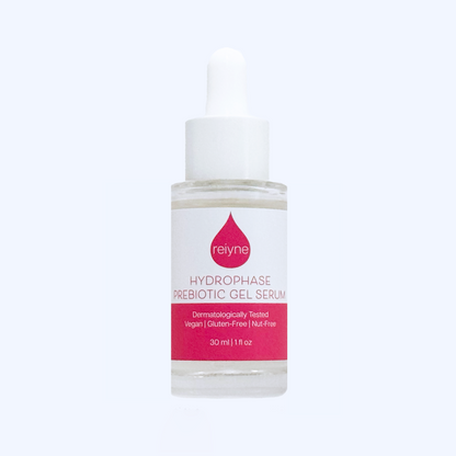 Reiyne HydroPhase Prebiotic Gel Serum in a clear bottle with white dropper and a pink and white label