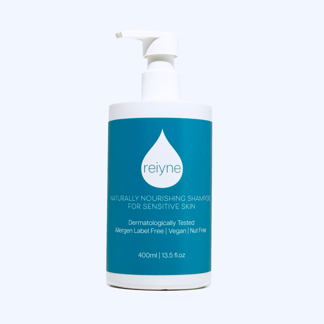 Reiyne Naturally Nourishing Shampoo for Sensitive Skin in a white pump bottle with Blue and white label