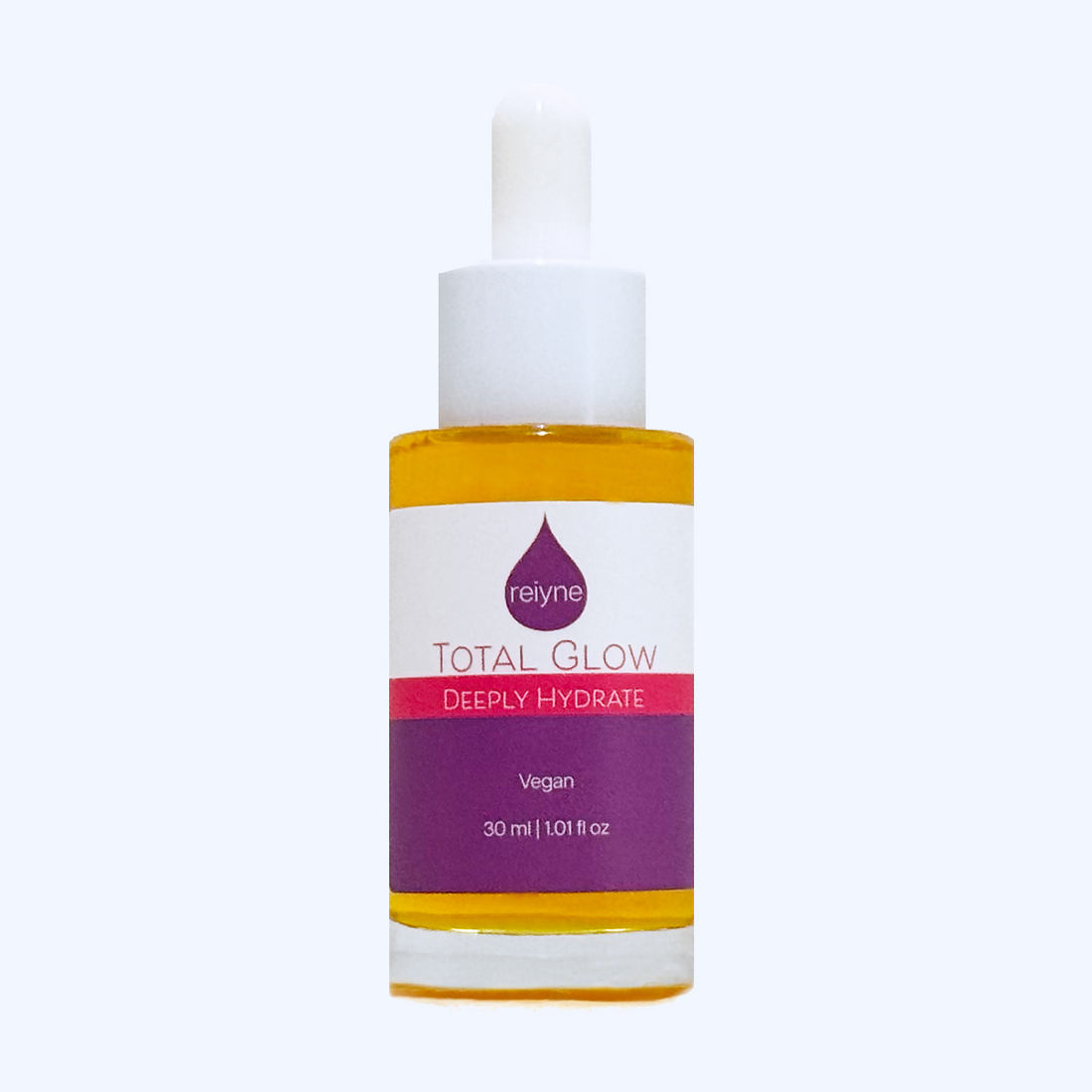 Reiyne Total Glow Serum in a clear bottle with White dropper and a purple and white label