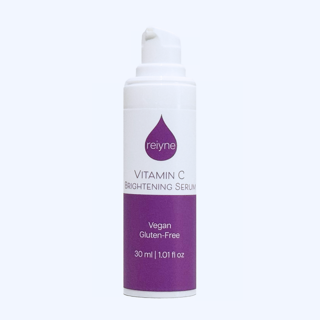 Reiyne Vitamin C Brightening Serum in a white airless pump bottle and a purple and white label
